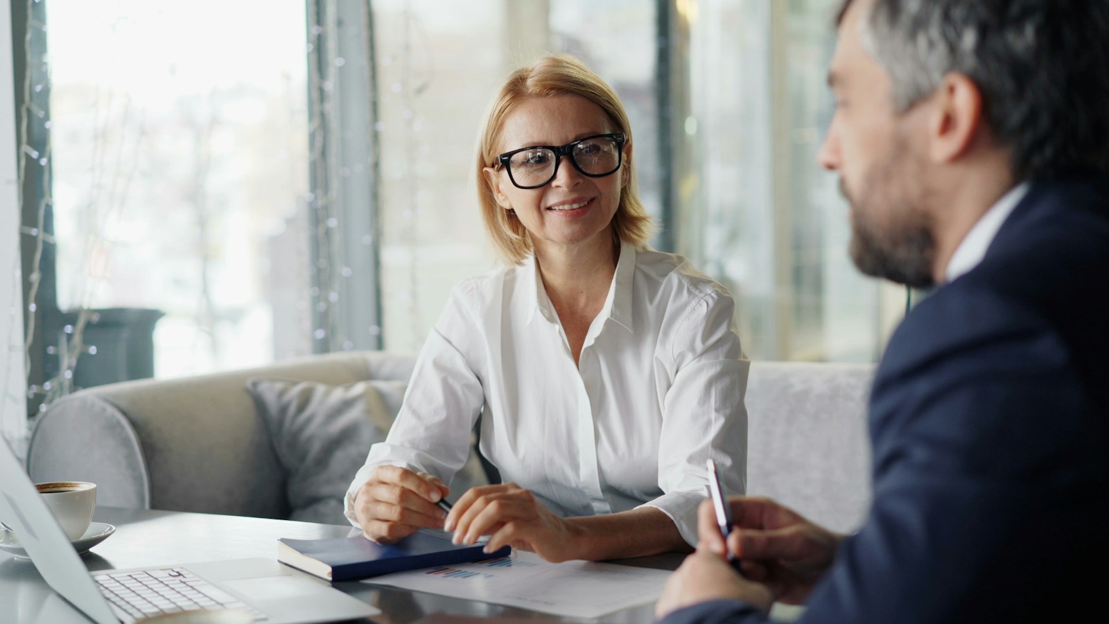 Elite Business Capital funding specialist consulting with a business owner